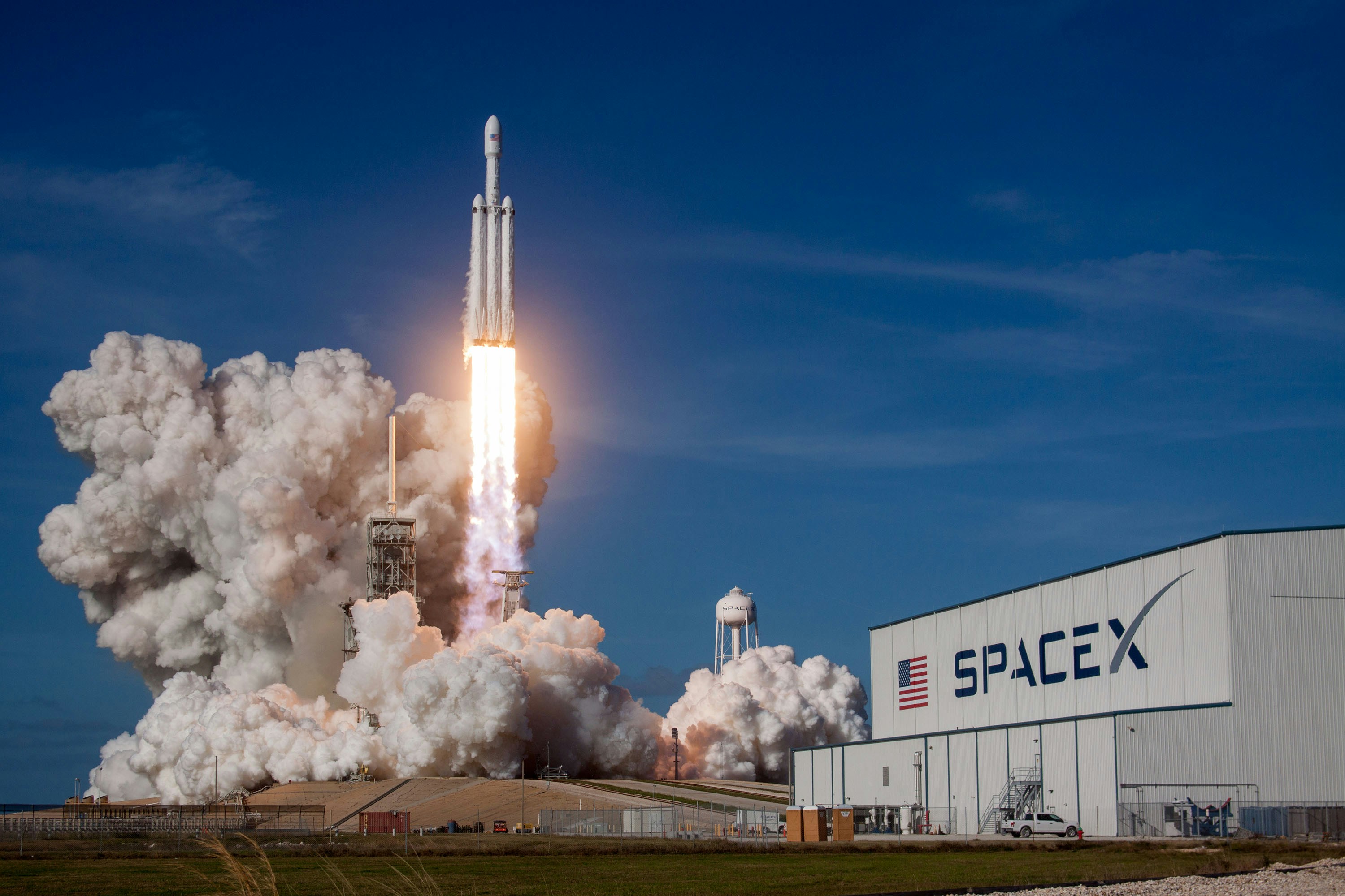SpaceX rocket lifting off from a launch pad